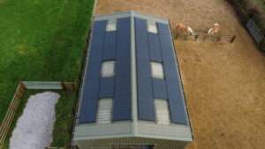 Commercial solar panel installation on barn roof