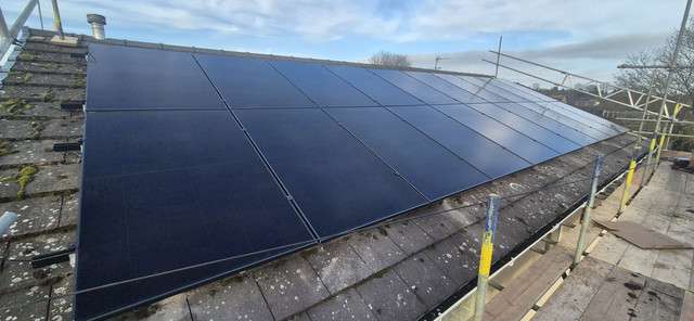 Residential roof with 20 panel solar PV system installed
